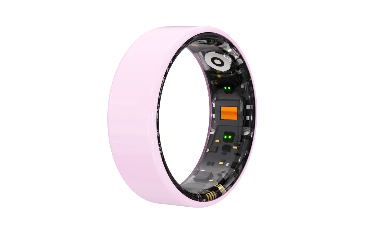 Cutaway view of pink Osawalla Ceramic Pro smart ring, showing internal sensors and electronic components
